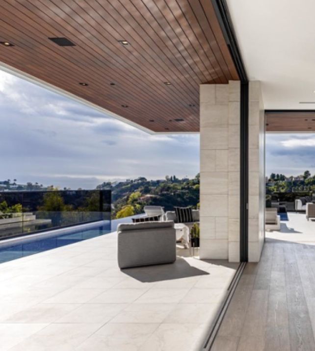 YAHOO — GenesisCare’s Dan Collins Pays $15.4 Million for Striking Bel Air Mansion